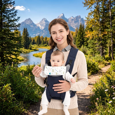 Maman en montagne avec bebe en porte bebe adaptable bleu